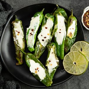 Stuffed Shishito peppers are a perfect blend of pepper flavors with garlic flavors. A easy, delicious bite sized snack on special occasions.