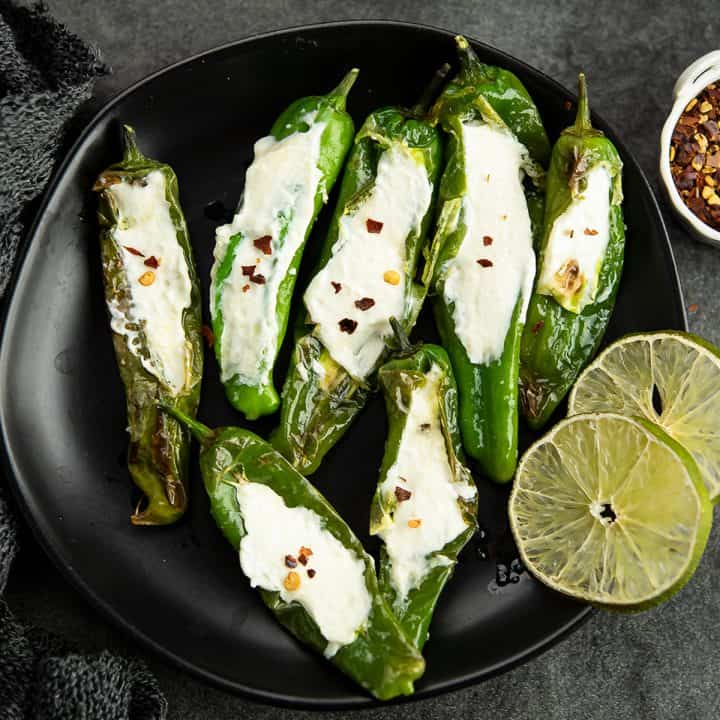 Stuffed Shishito peppers are a perfect blend of pepper flavors with garlic flavors. A easy, delicious bite sized snack on special occasions.