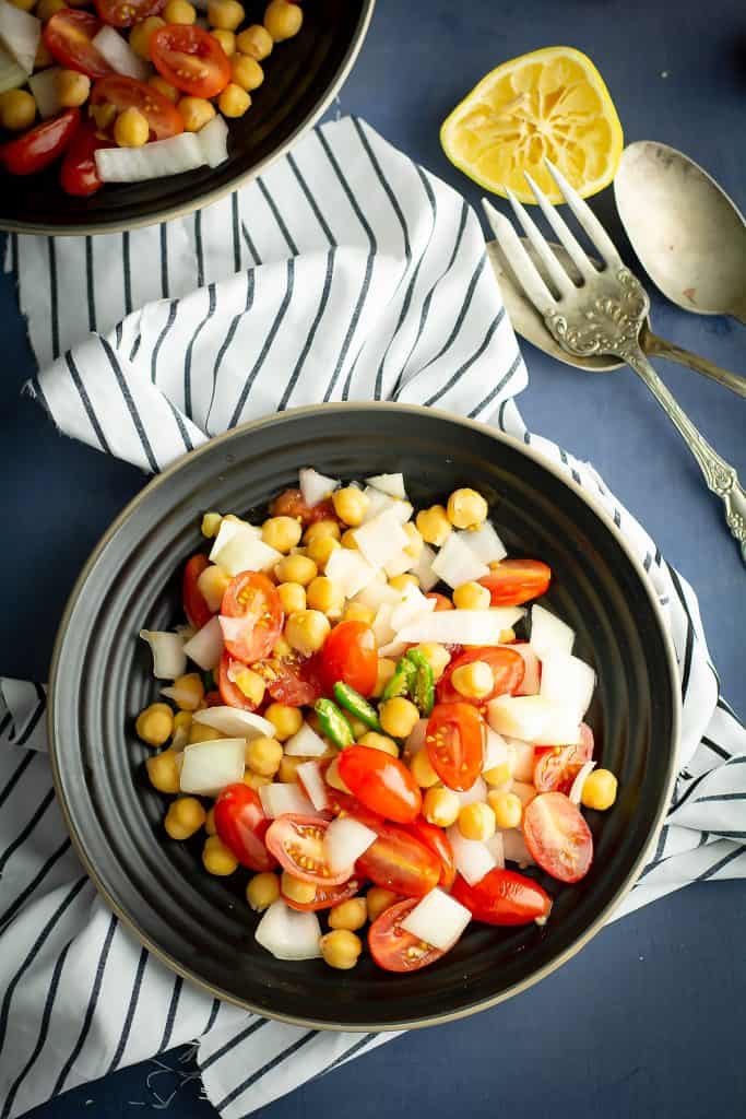 Indian tomato salad is loaded with tomatoes, onion, vegan protein chickpea. Means, a light, easy, filling dinner for your busy weeknight.
