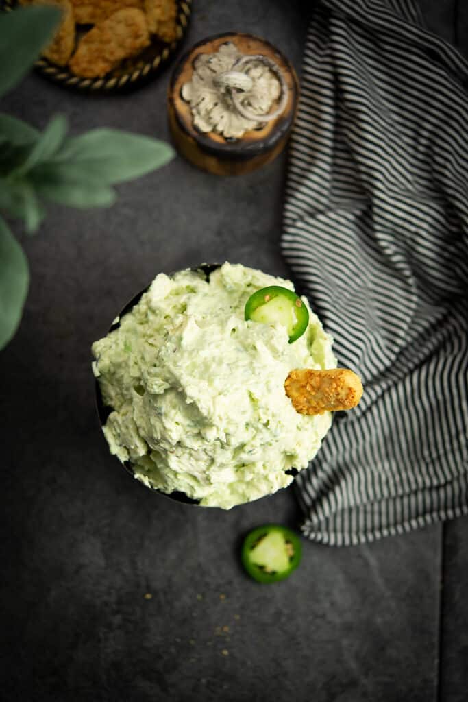 Jalapeno cream cheese dip in a black  dipping bowl