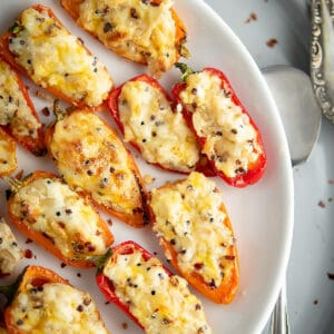 This cream cheese stuffed mini peppers is the BEST. Easy recipe to serve as an appetizer/main dish, in a party or weeknight dinner.