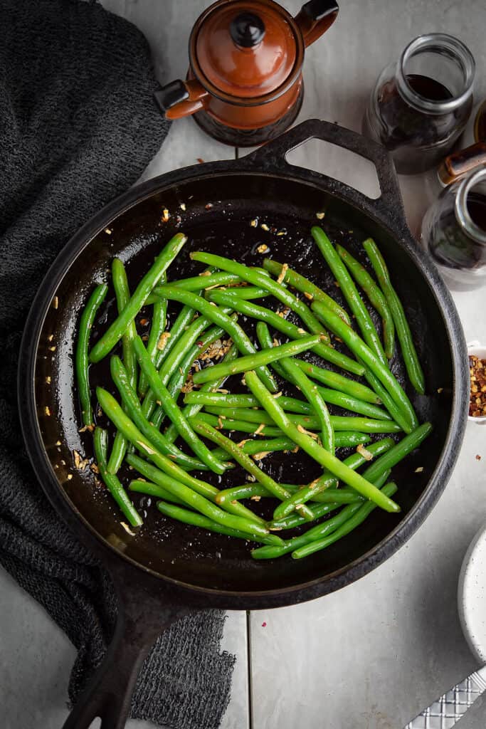 This spicy Sriracha green beans recipe is easy to put together under 20 minutes effortlessly-a quick option to serve a spicy side dish.
