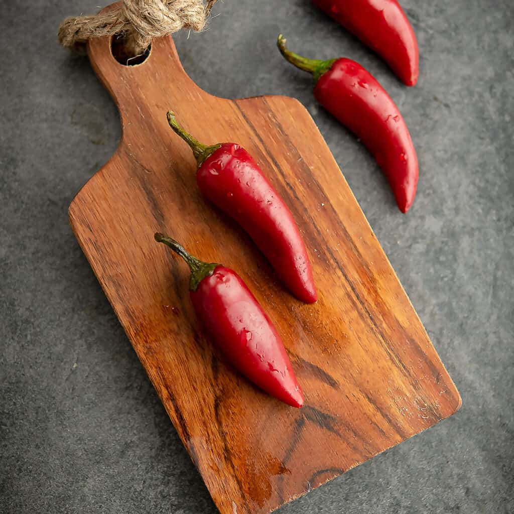 Fresno peppers placed in a small cutting board