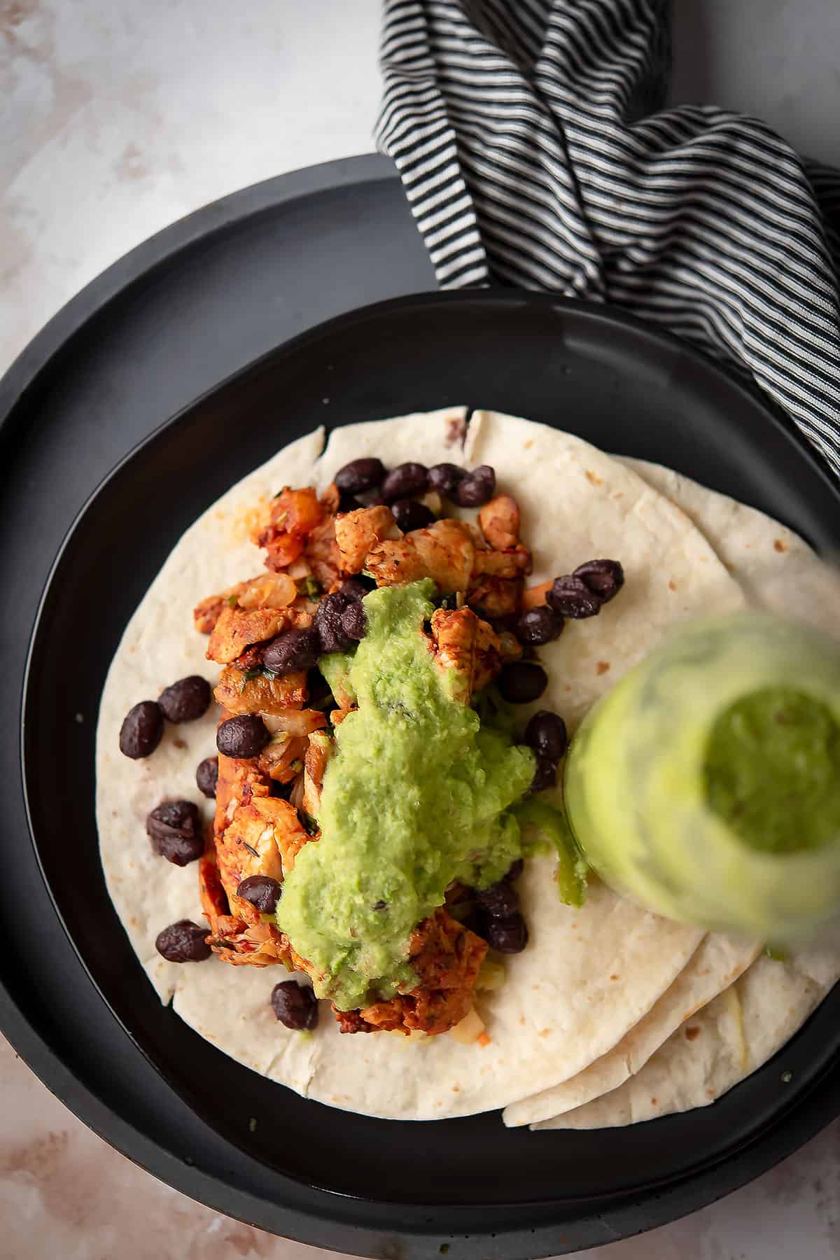 spicy green taco sauce served over tortillas