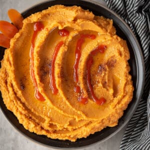 This creamy, sweet and spicy chickpea dip-carrot Sriracha hummus is the real fun dip that can turn out as your new addiction. 