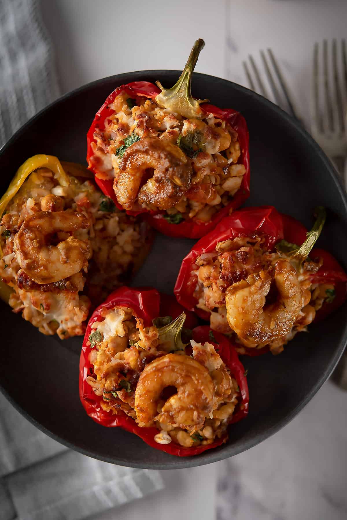 seafood stuffed peppers in a a white deep dish