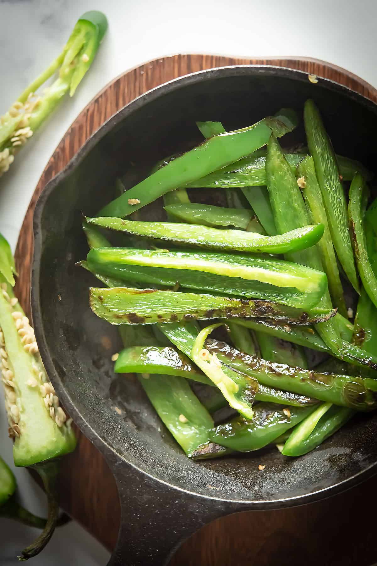 sauteed jalapeno in a cast iron pan