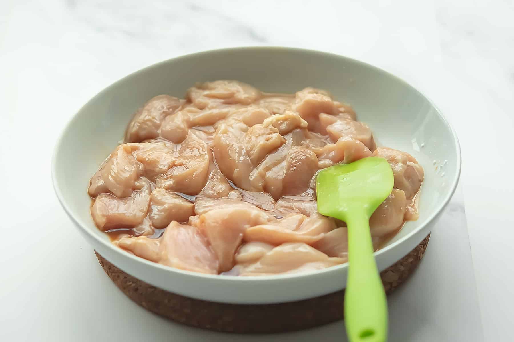 prepped chicken in a white bowl