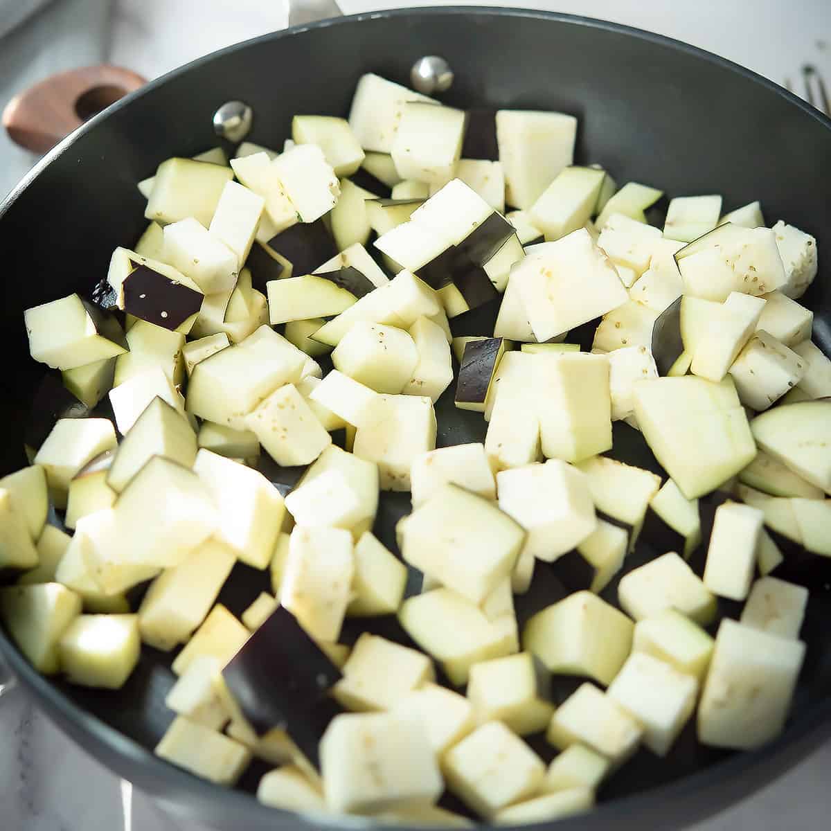 eggplant in pan for sauteing