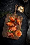hot honey lemon pepper wings served in tray