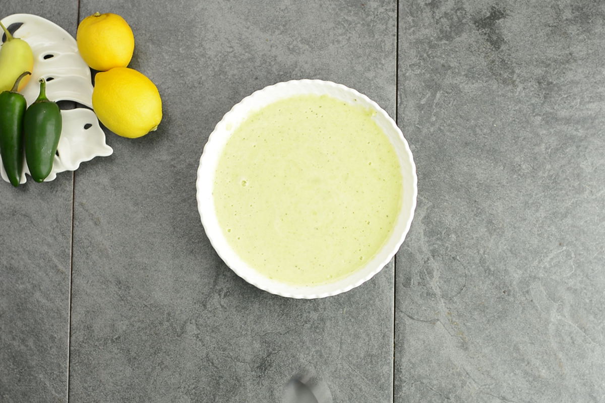 the ground pineapple, jalapeno mixture in a flat bowl