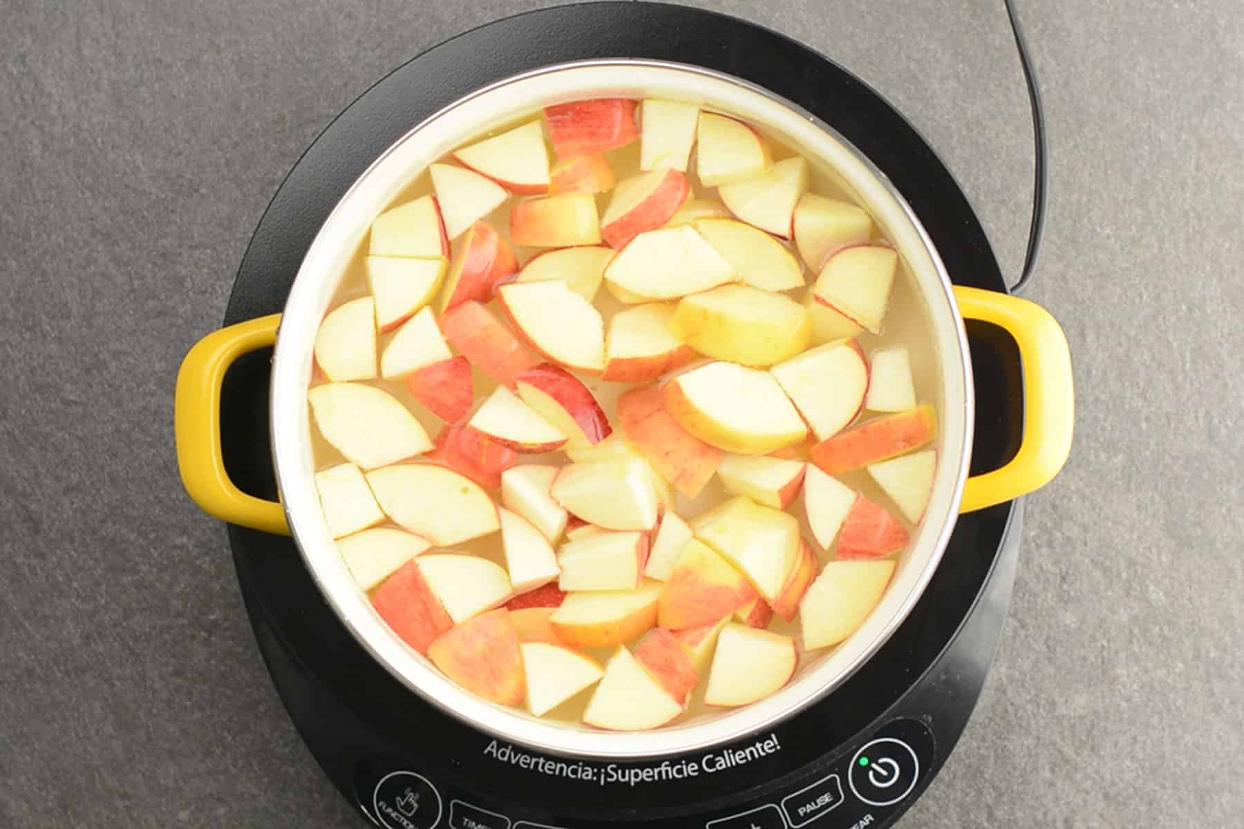 apple in boiling water for making apple juice