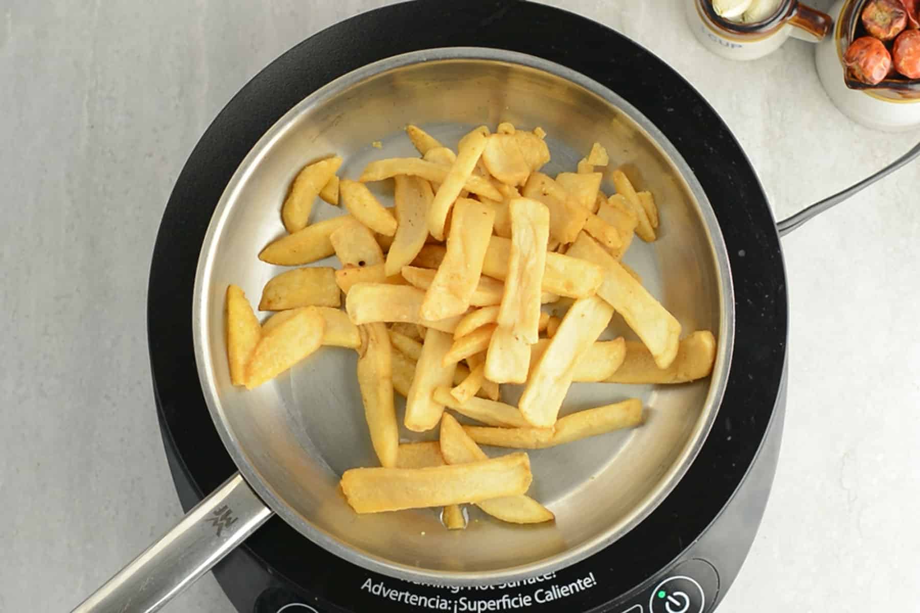 fries placed in the pan for making chinese french fries