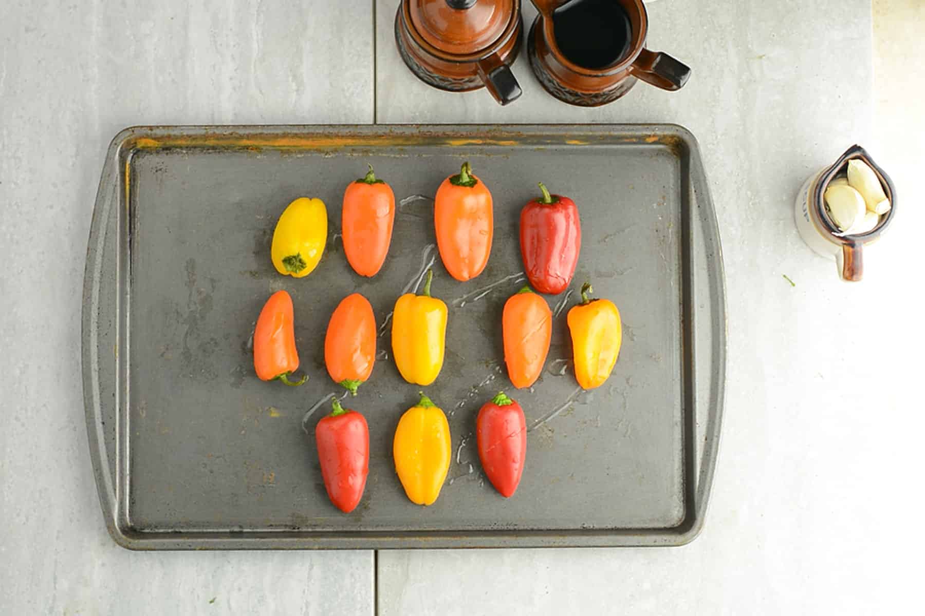 mini peppers prepped in a tray for roasting