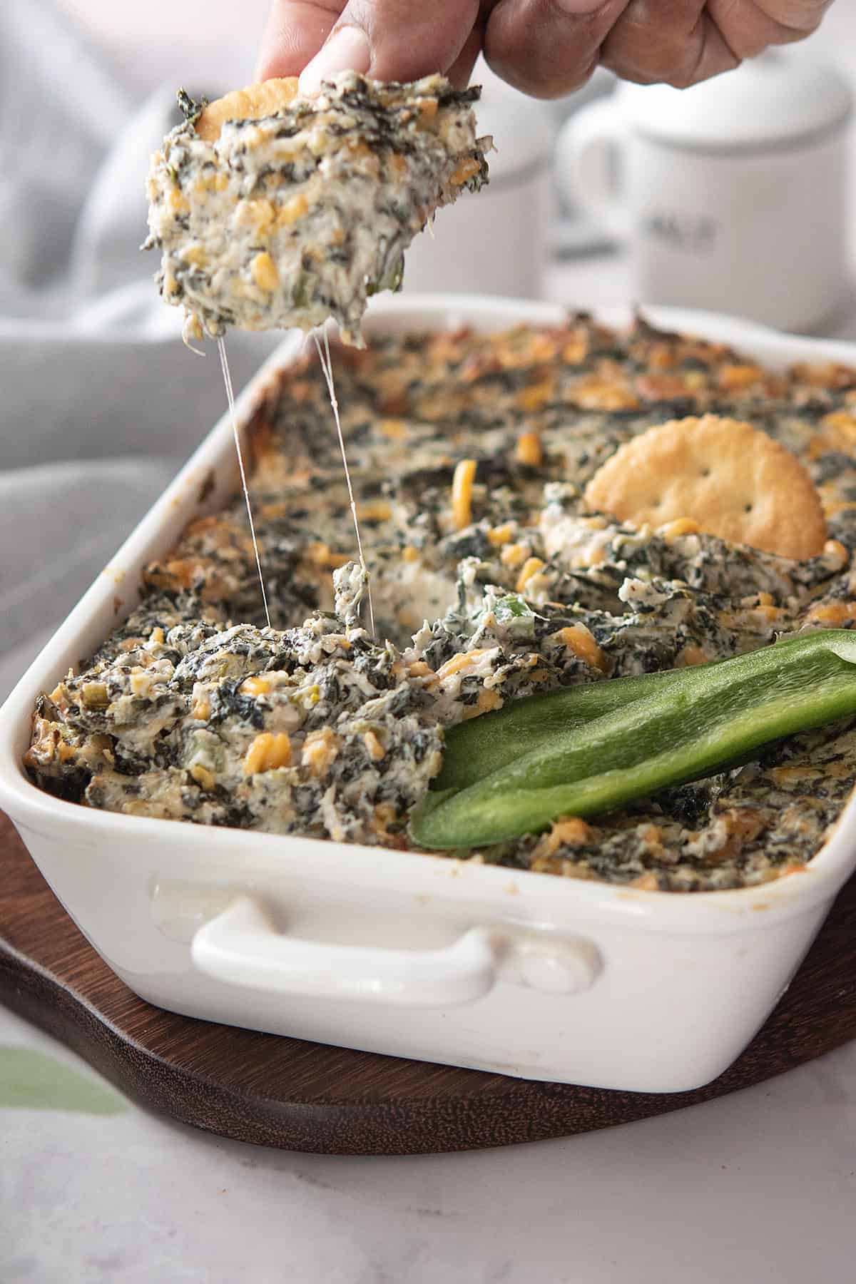 cheese strings from the jalapeno spinach dip while serving