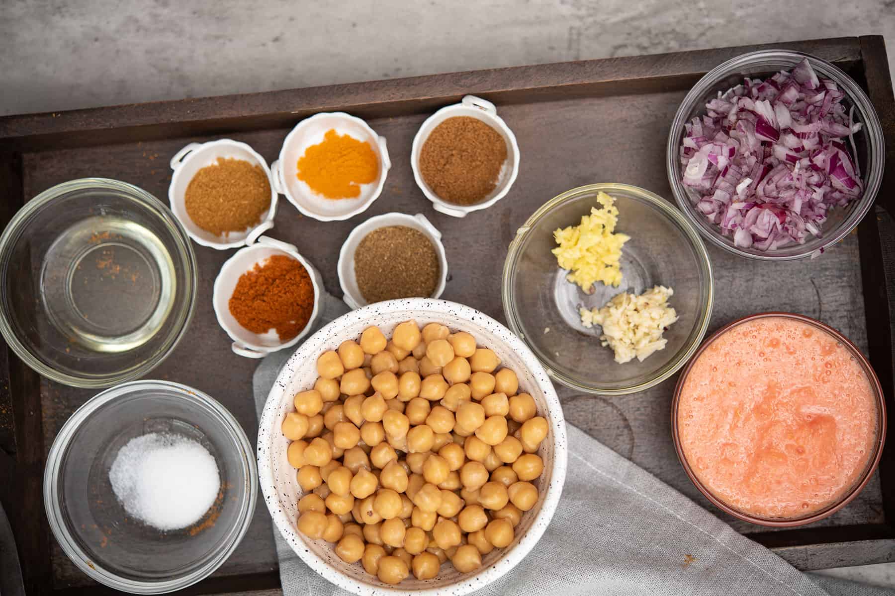 ingredients for almond milk curry placed in a wooden tray