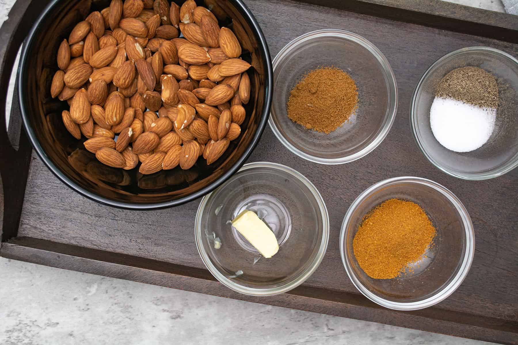 ingredients assembled in a tray for making curried almonds