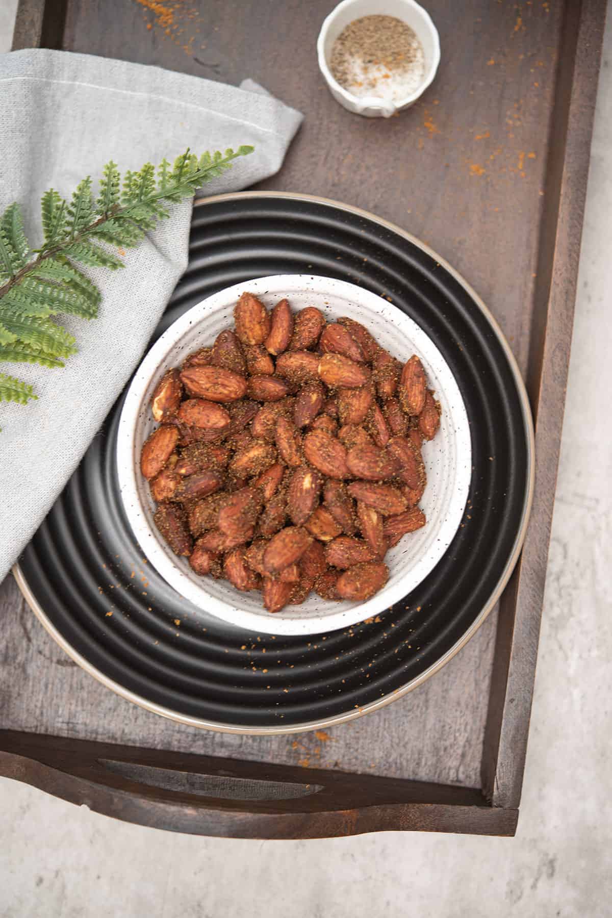 curried almonds placed in a white bowl