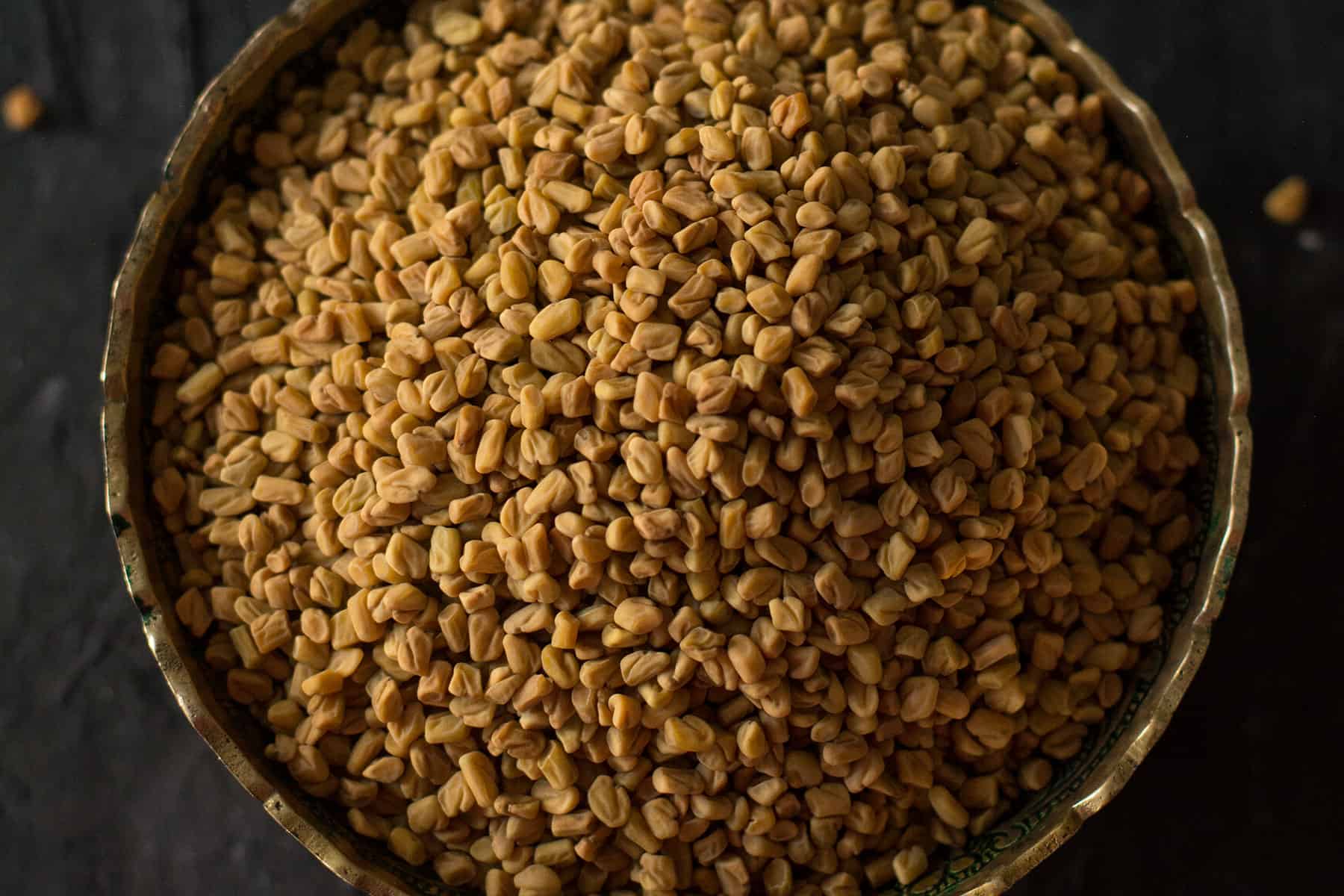fenugreek seeds in a decorative bowl