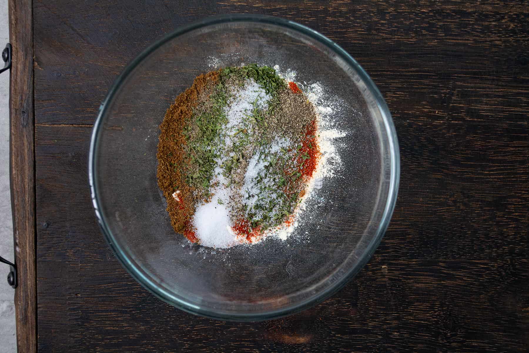 all the ingredients for cuban spice blend added in a bowl