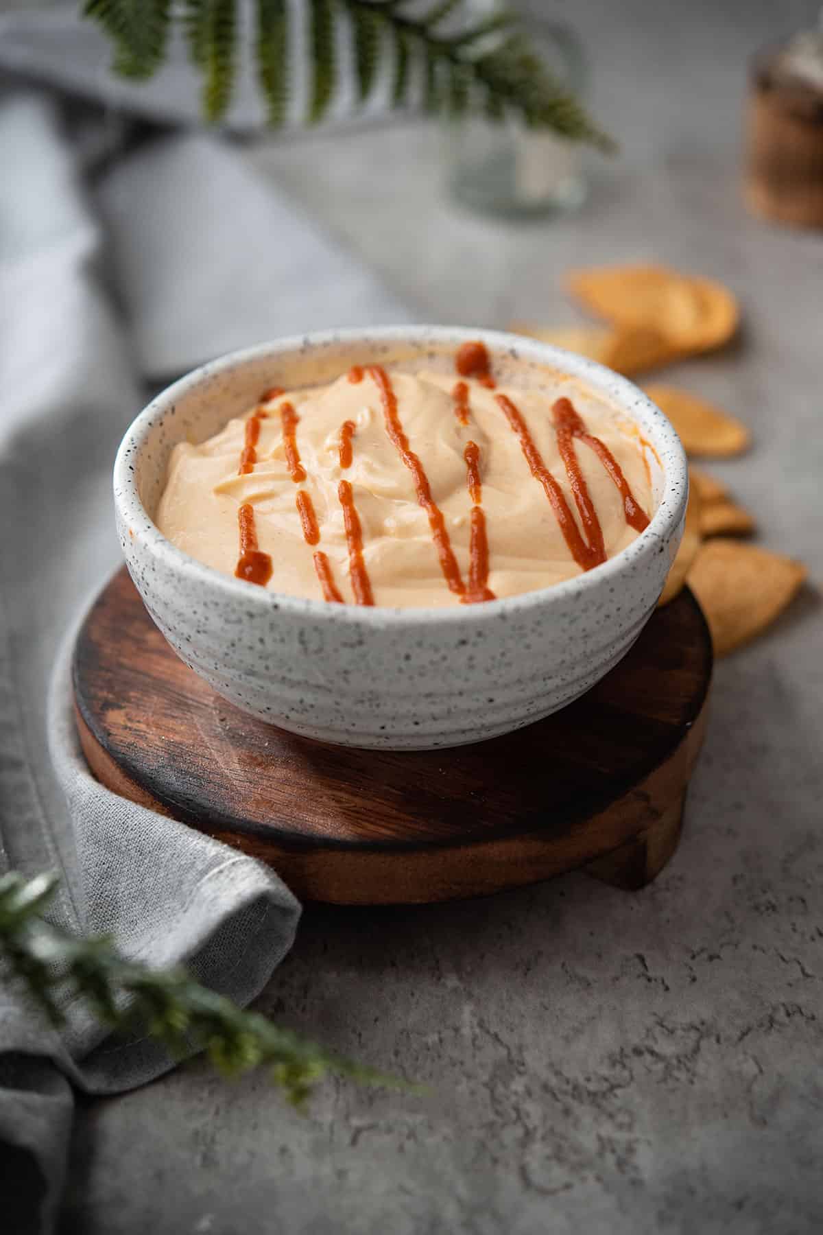 Spicy garlic aioli sauce in a white bowl