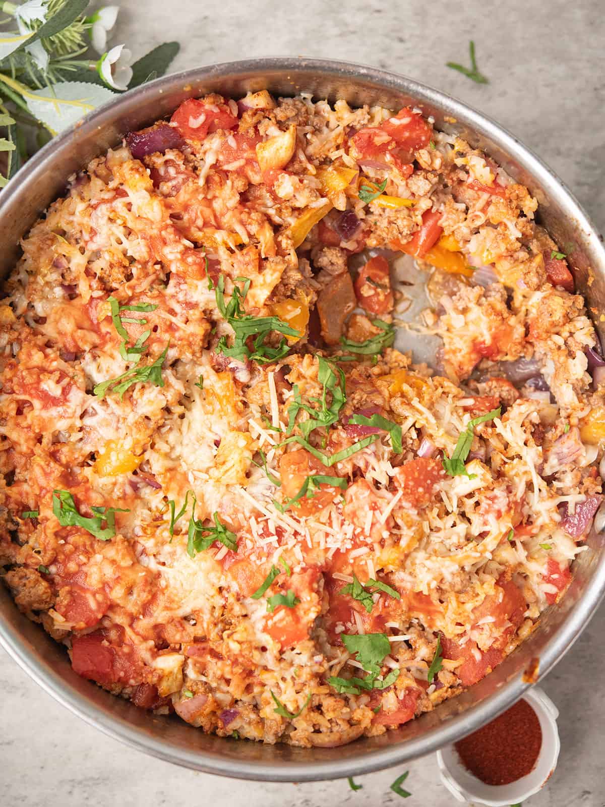baked to the perfection deconstructed stuffed pepper with cheese topping in a pan