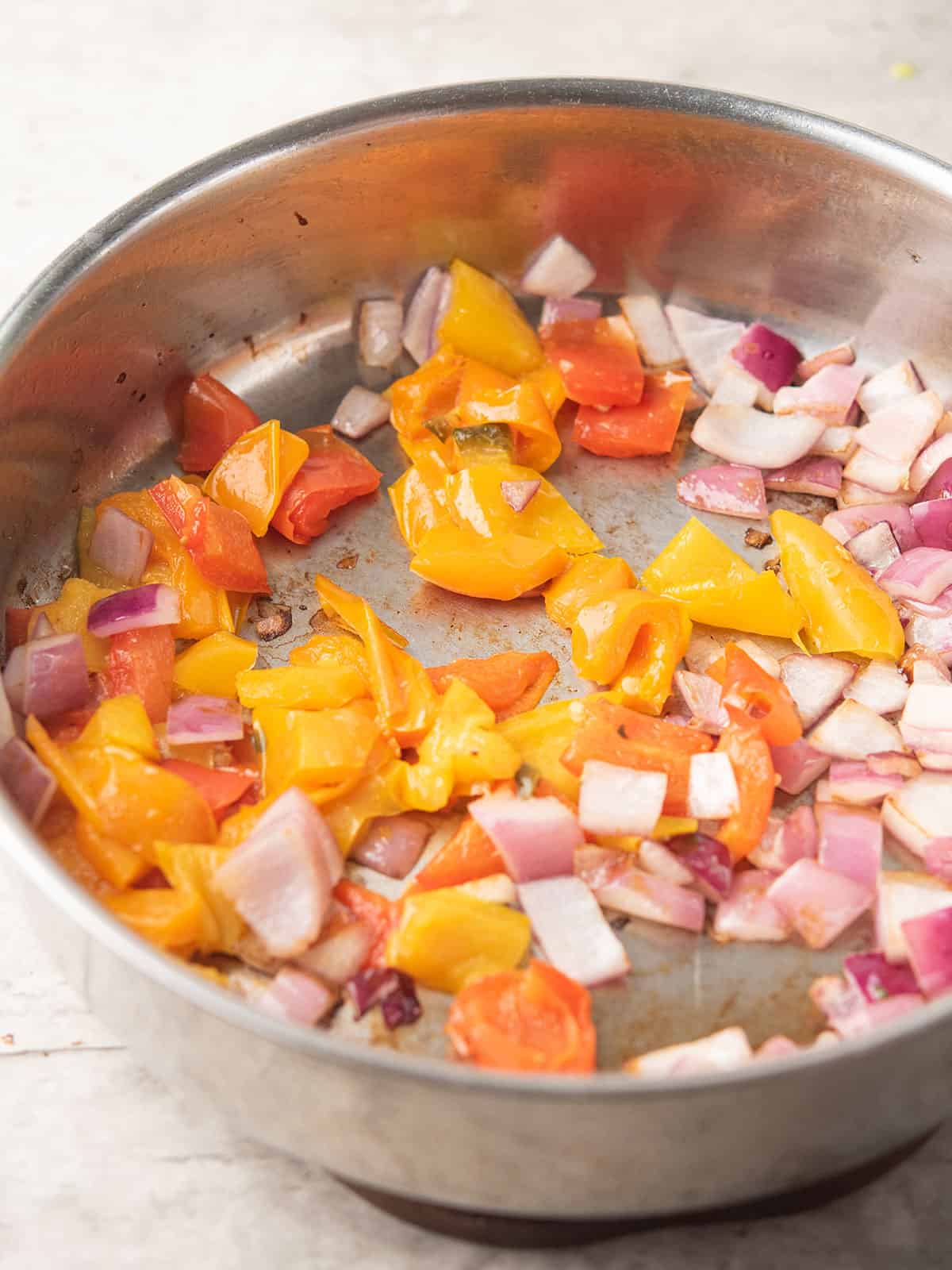 step 1: onion and peppers in the pan for making deconstructed stuffed pepper