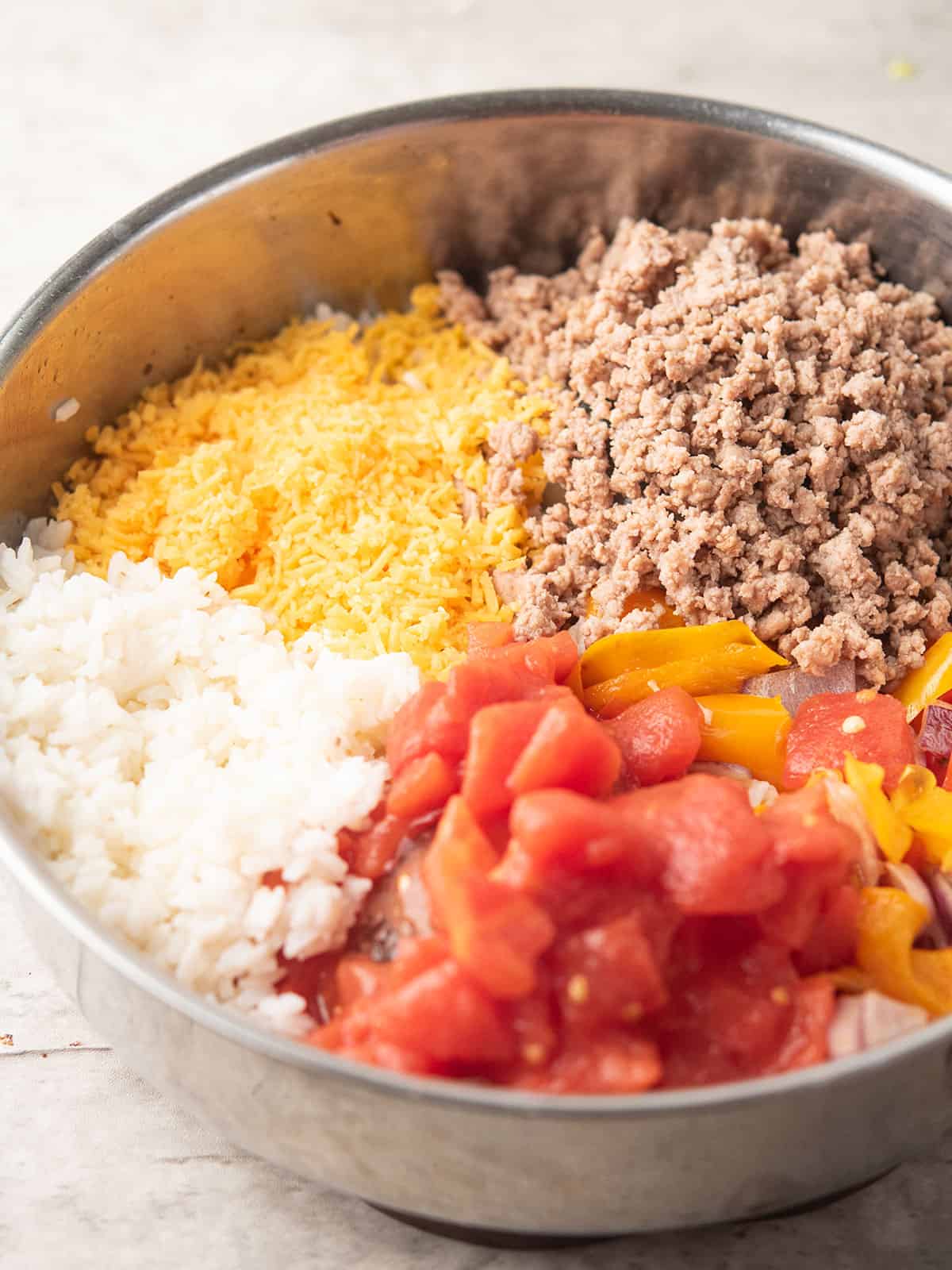 step 3: all rice, cooked ground turkey, sauteed onion& peppers, rice added to the pan for making deconstructed stuffed pepper