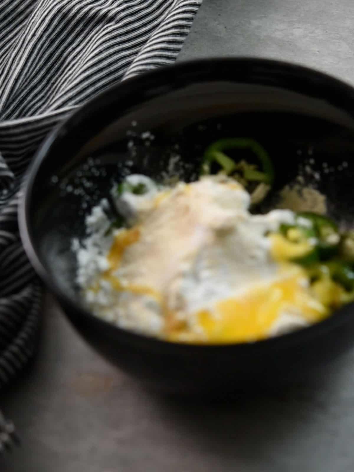 step:1  the mixture for crispy fried jalapeno in a bowl