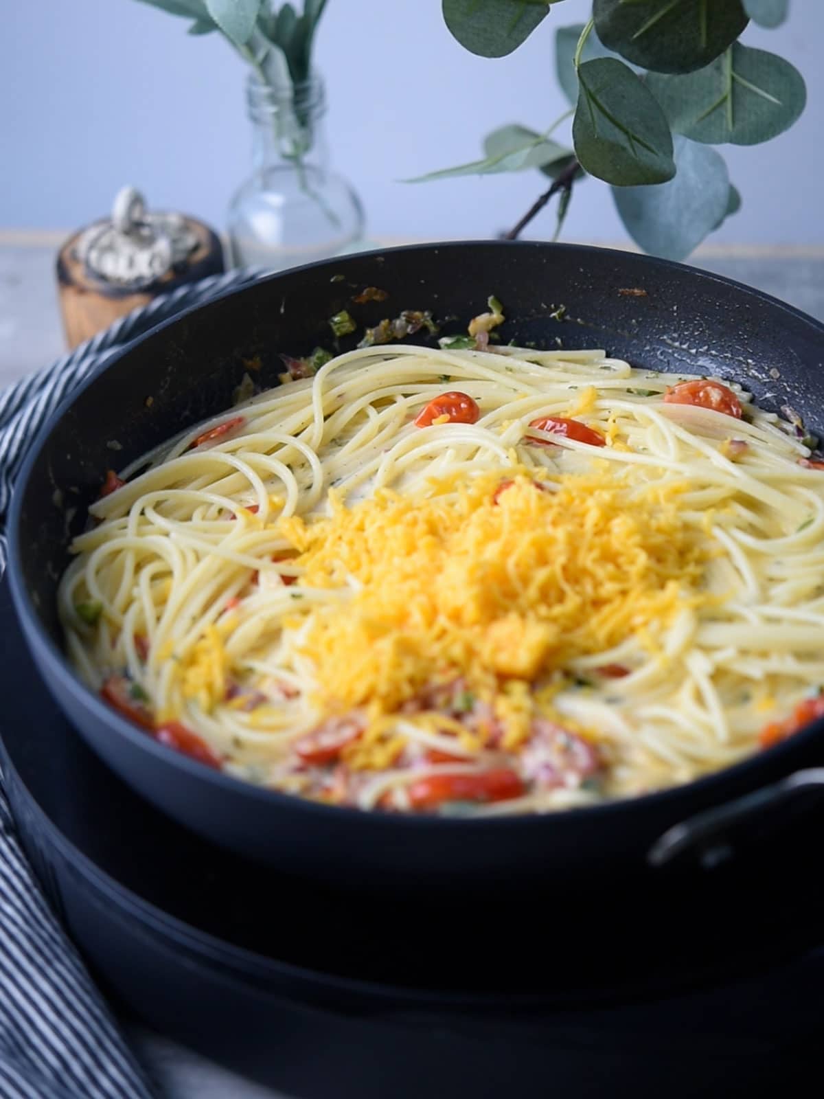 step:1 the grated cheese on the top for making jalapeno spaghetti