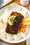 blackened mahi mahi served with rice in a bowl