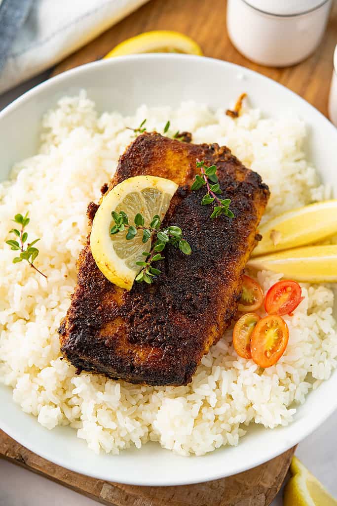 blackened mahi mahi served with rice in a bowl