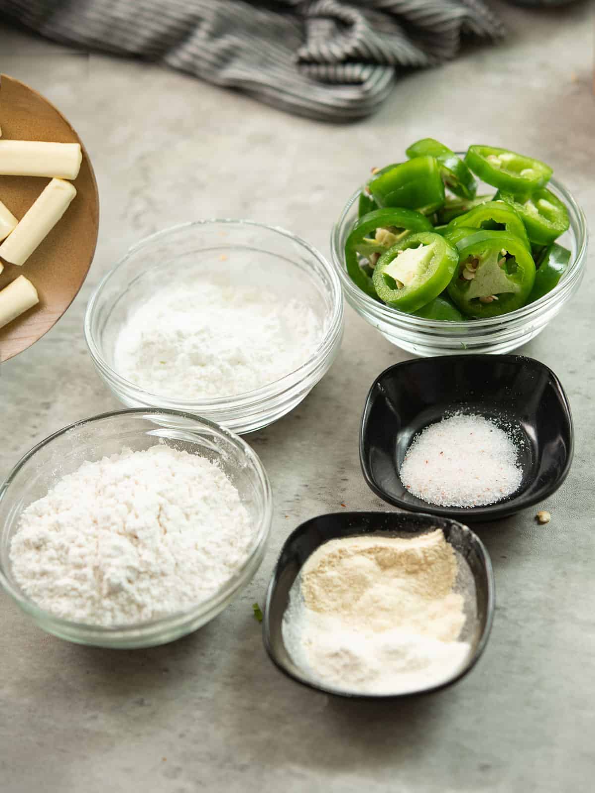 the ingredients for the Jalapeno Cheese Sticks are assembled in the kitchen counter