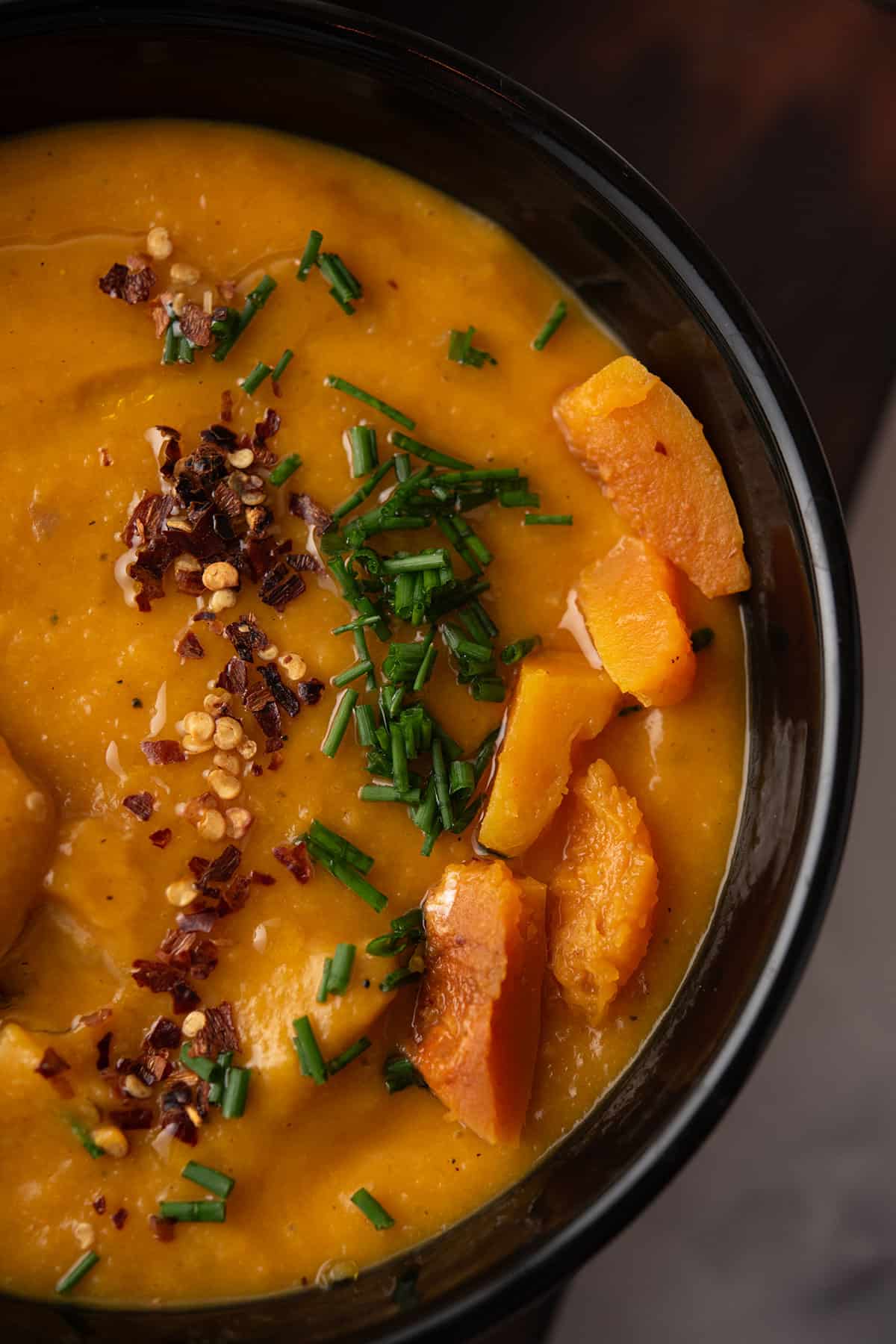 butternut squash soup spicy with the spicy topping like red pepper flakes
