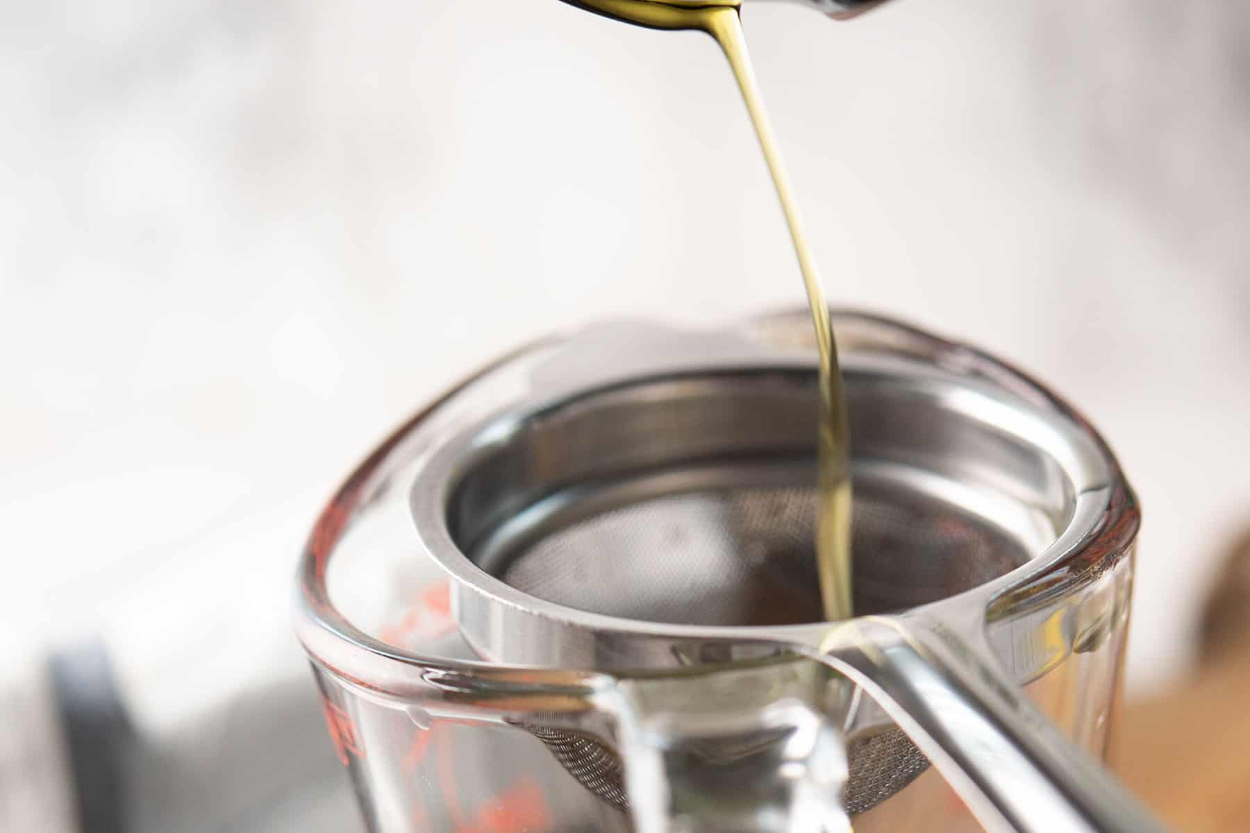 straining jalapeno olive oil