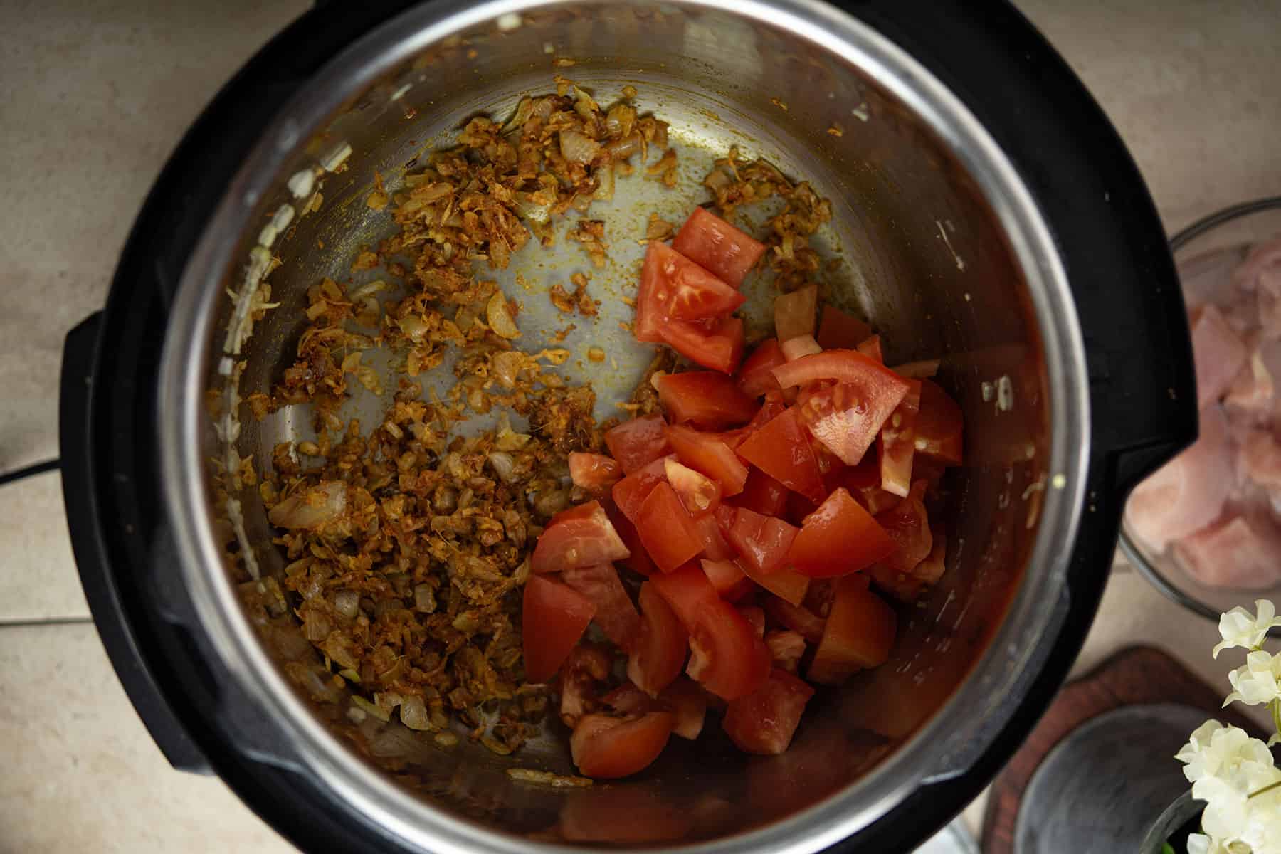 adding roughly chopped tomatoes