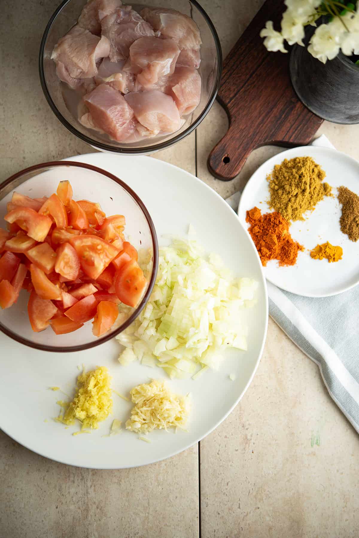 instant pot chicken curry ingredients are arranged in the kitchen counter