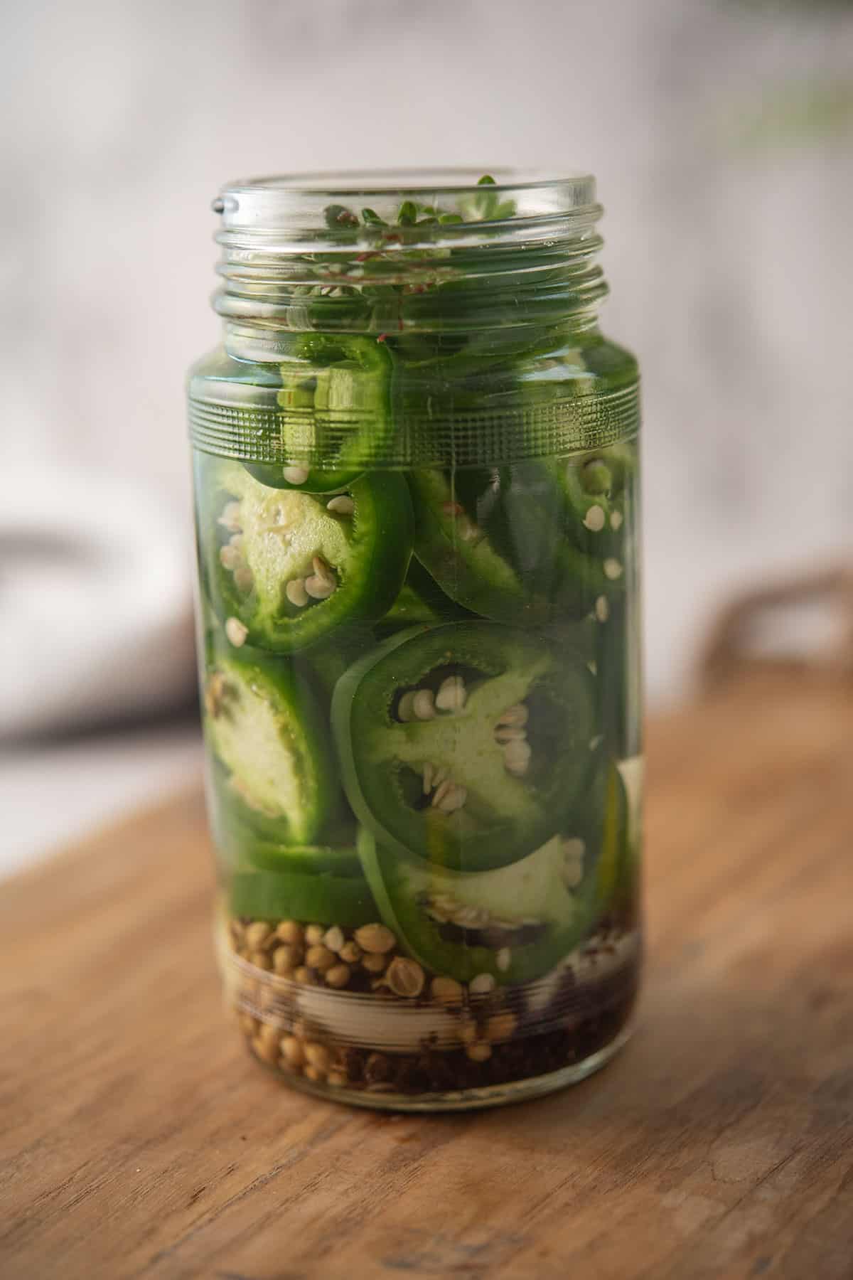 pickled jalapeno in a glass jar
