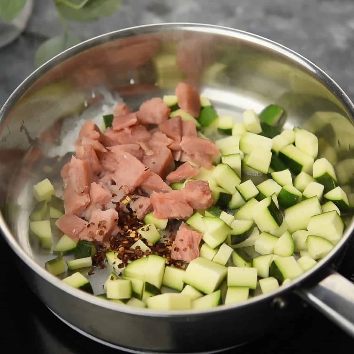 salmon-zucchini-saute in a pan