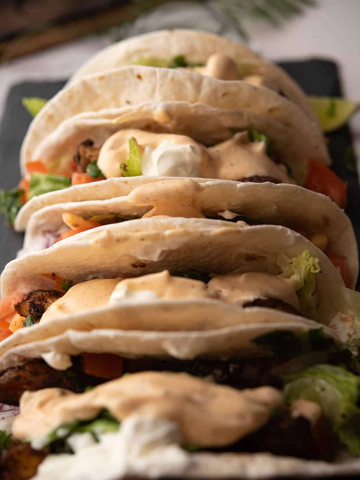 fish taco sauce slathered over tacos