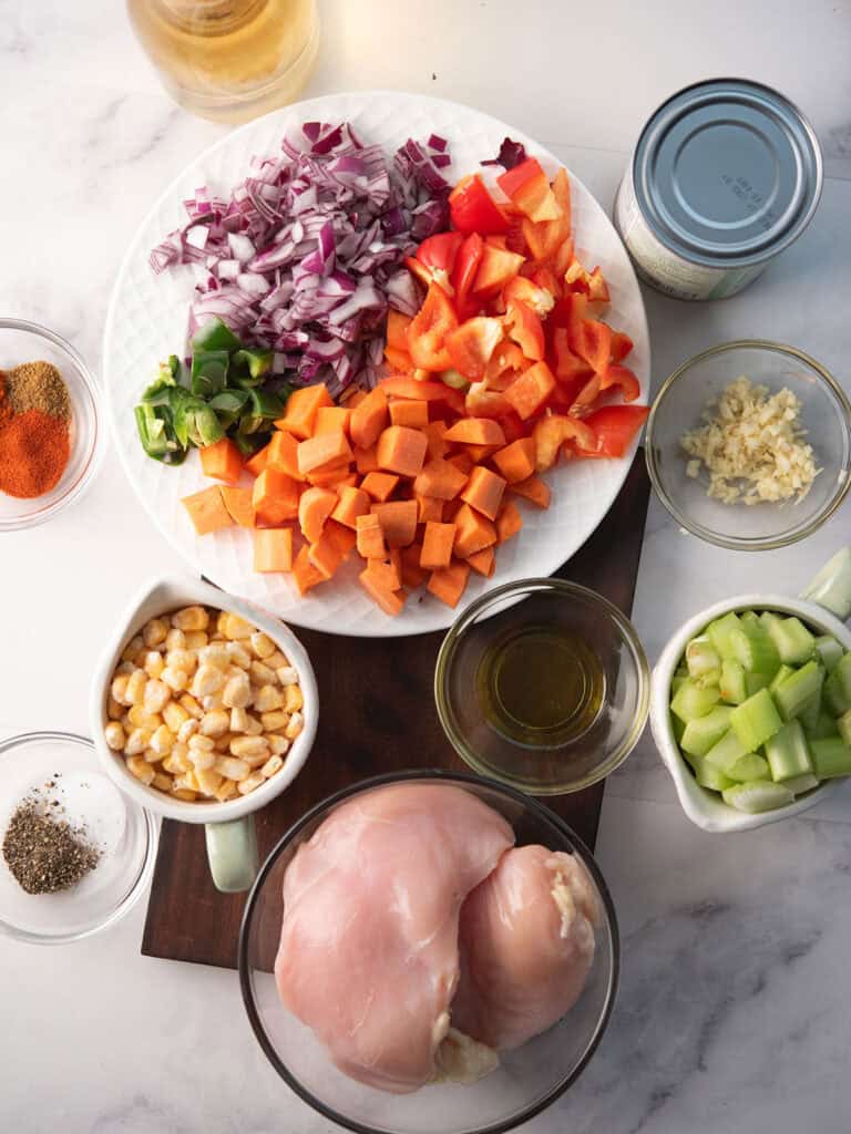 spicy chicken soup's ingredients are arranged in the counter top