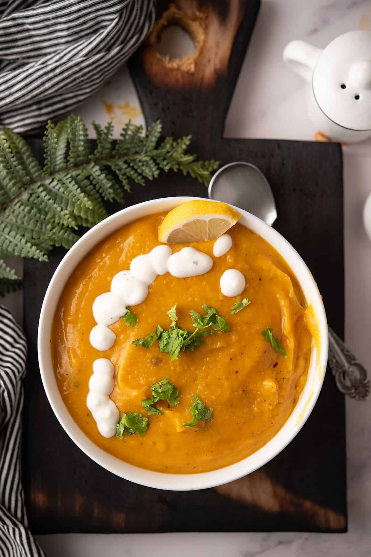 3 ingredient butternut squash soup served in a white bowl