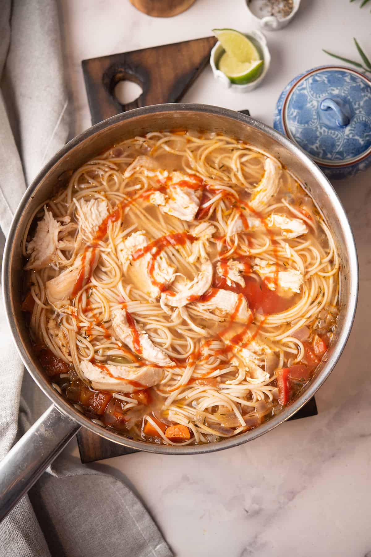 chunky spicy chicken noodle soup in a pan