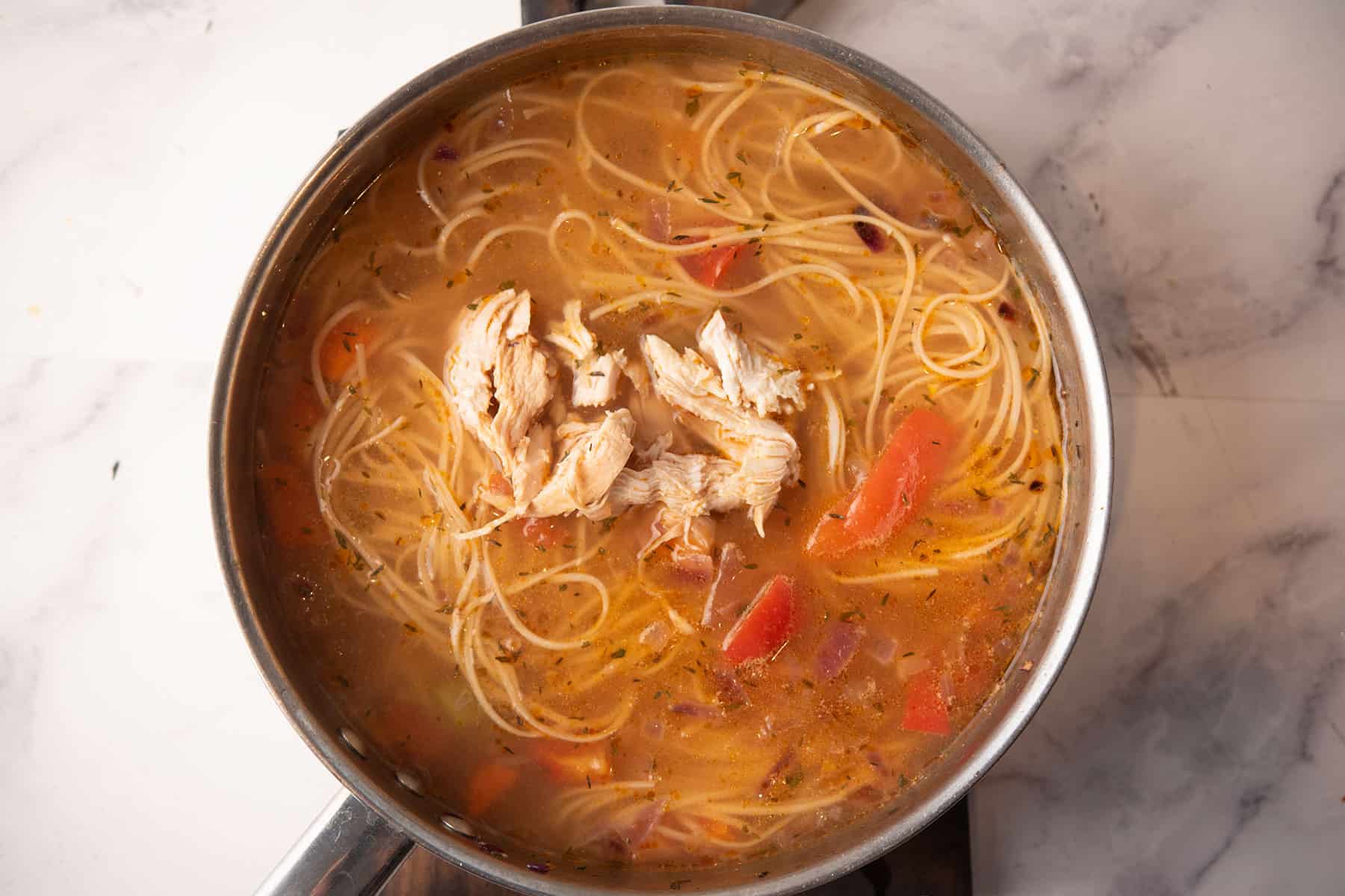 shredded chicken returned to the spicy chicken noodle soup