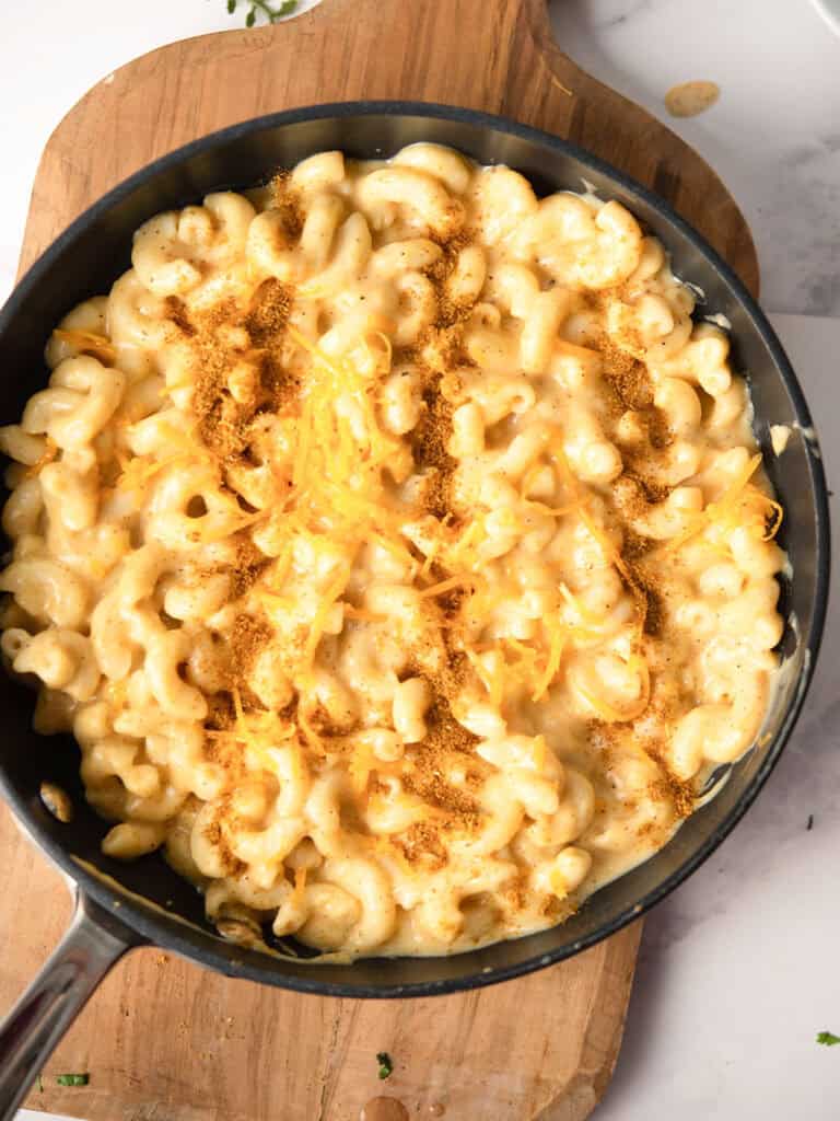 cheesy, bubbly curry mac and cheese cooked hot over pan