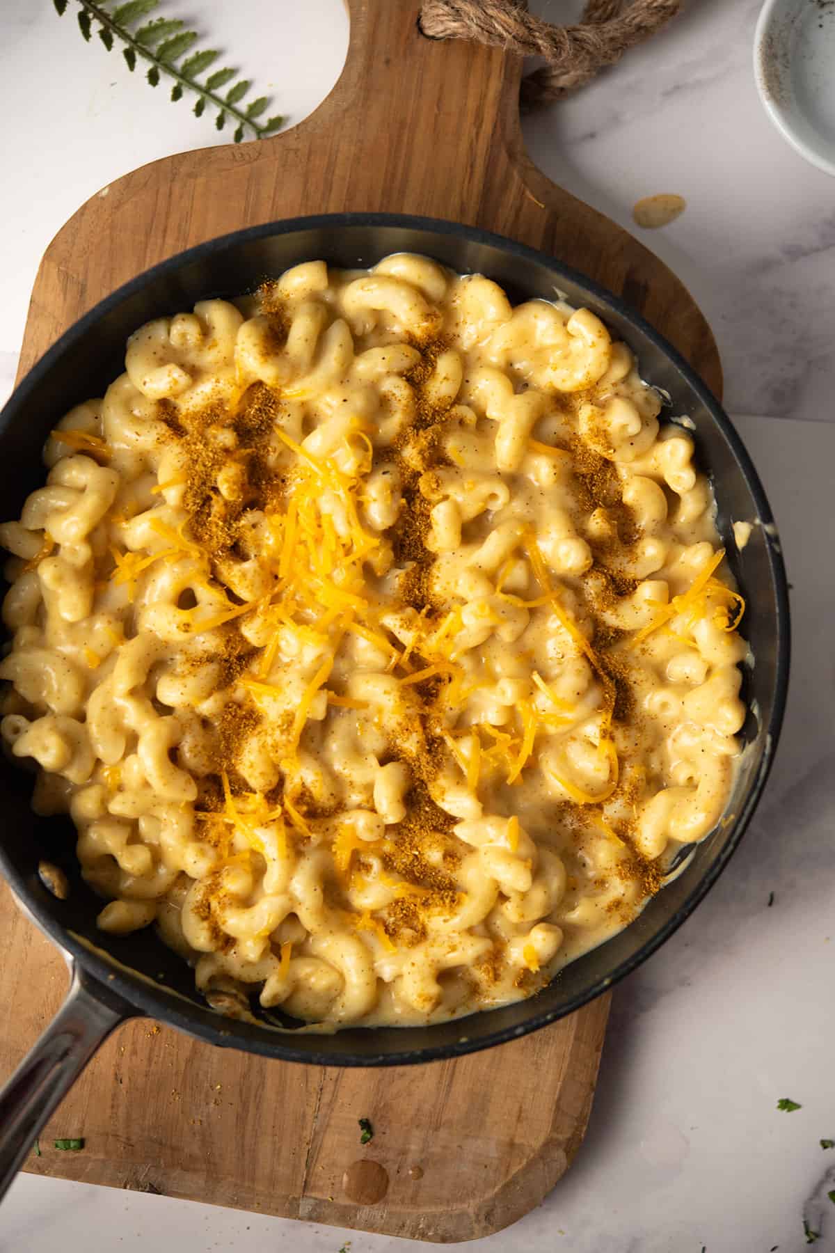 curried mac and cheese cooked in a sauce pan