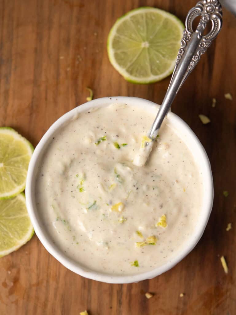ginger aioli served in a bowl with lime slices