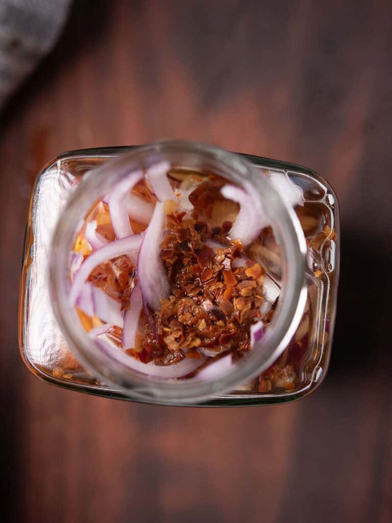 the spicy pickled onion soaked with red pepper mix liquid