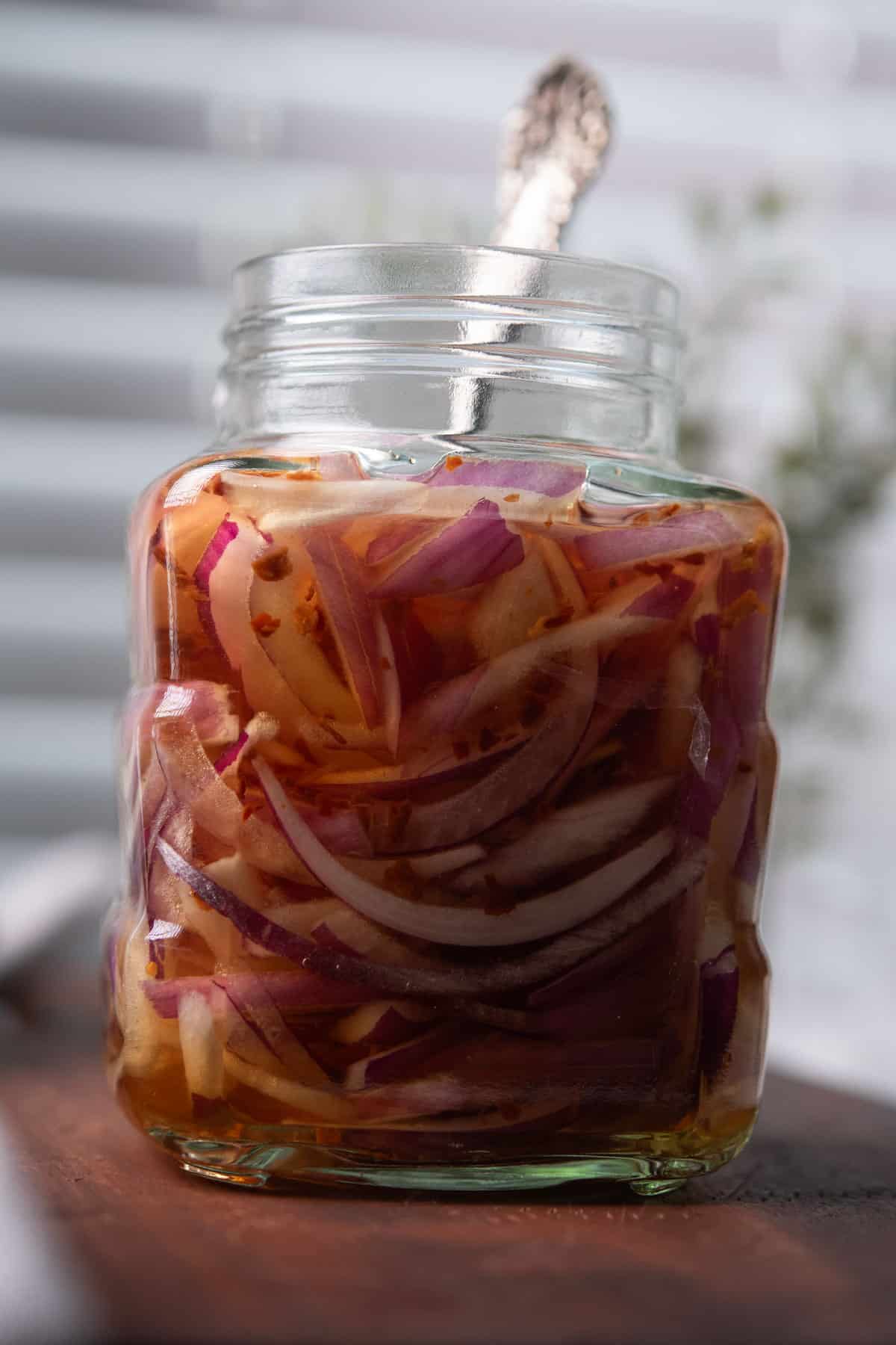spicy pickled onion in a glass jar