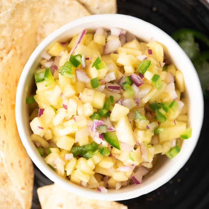 pineapple jalapeno salsa in a white bowl